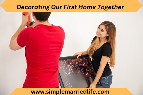 couple setting painting on wall in new home