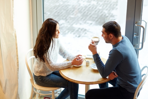 happy couple drinking tea at coffee