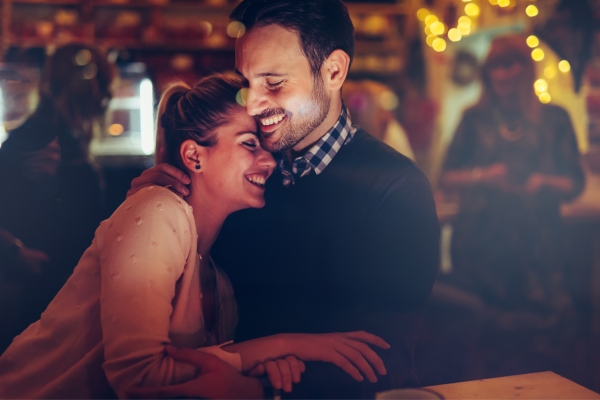 romantic couple dating at pub in night 