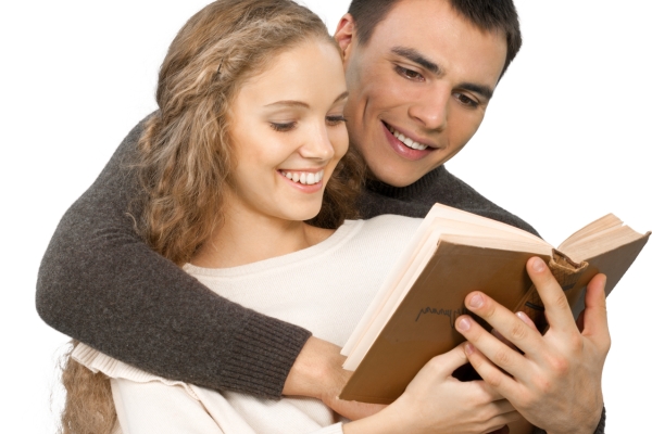 happy smiling couple reading book togather