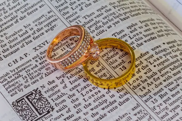 bible with couple rings