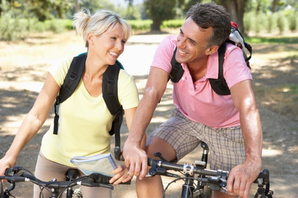 middle aged riding on cyle to grow intimacy